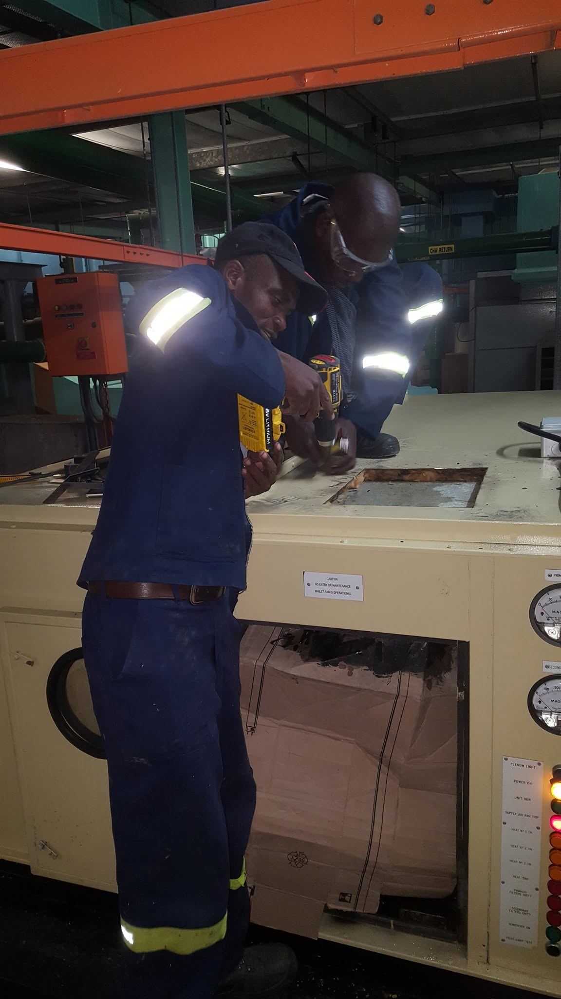 NP Investments team member welding a steel frame