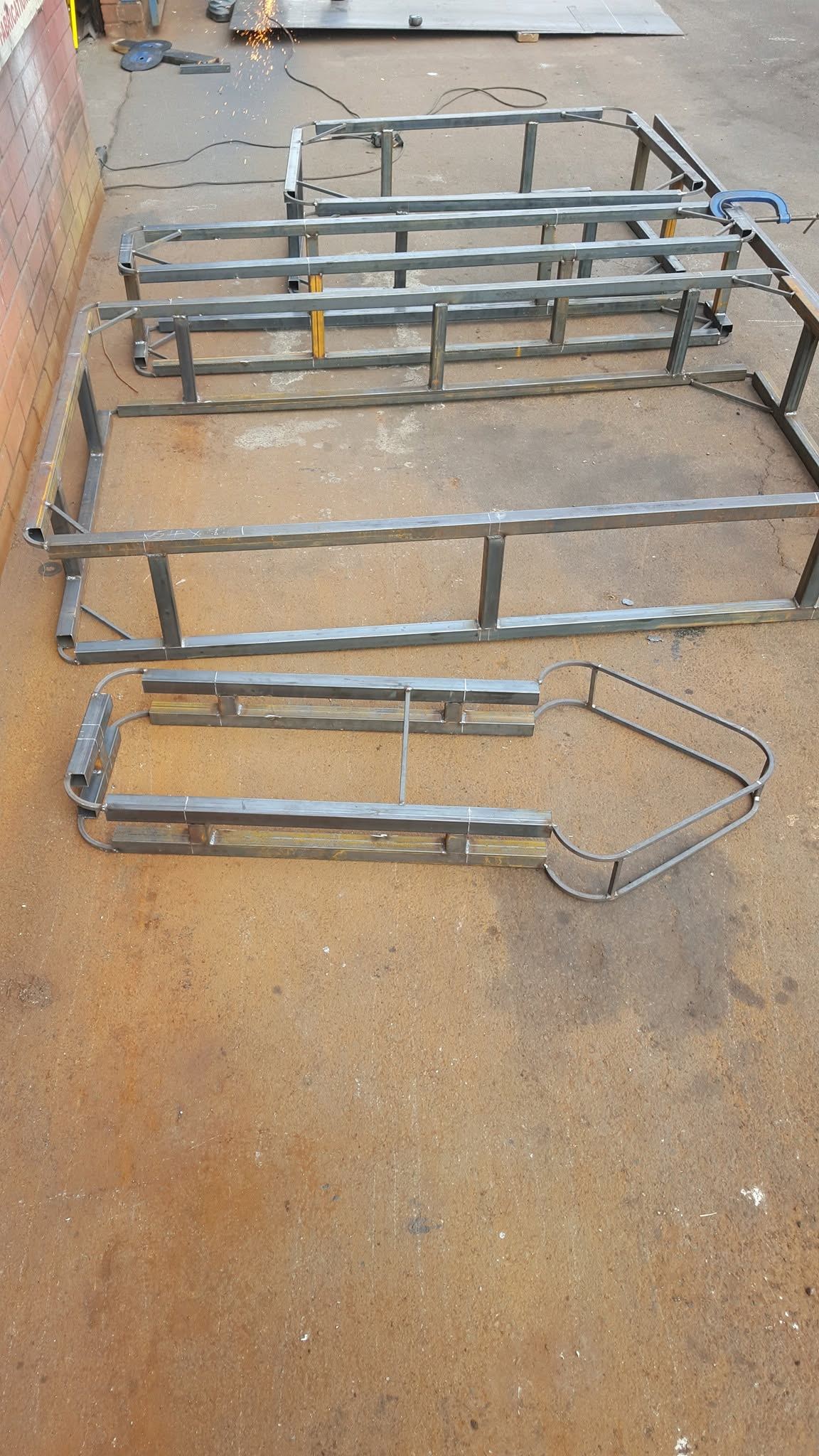 Bent steel rail section