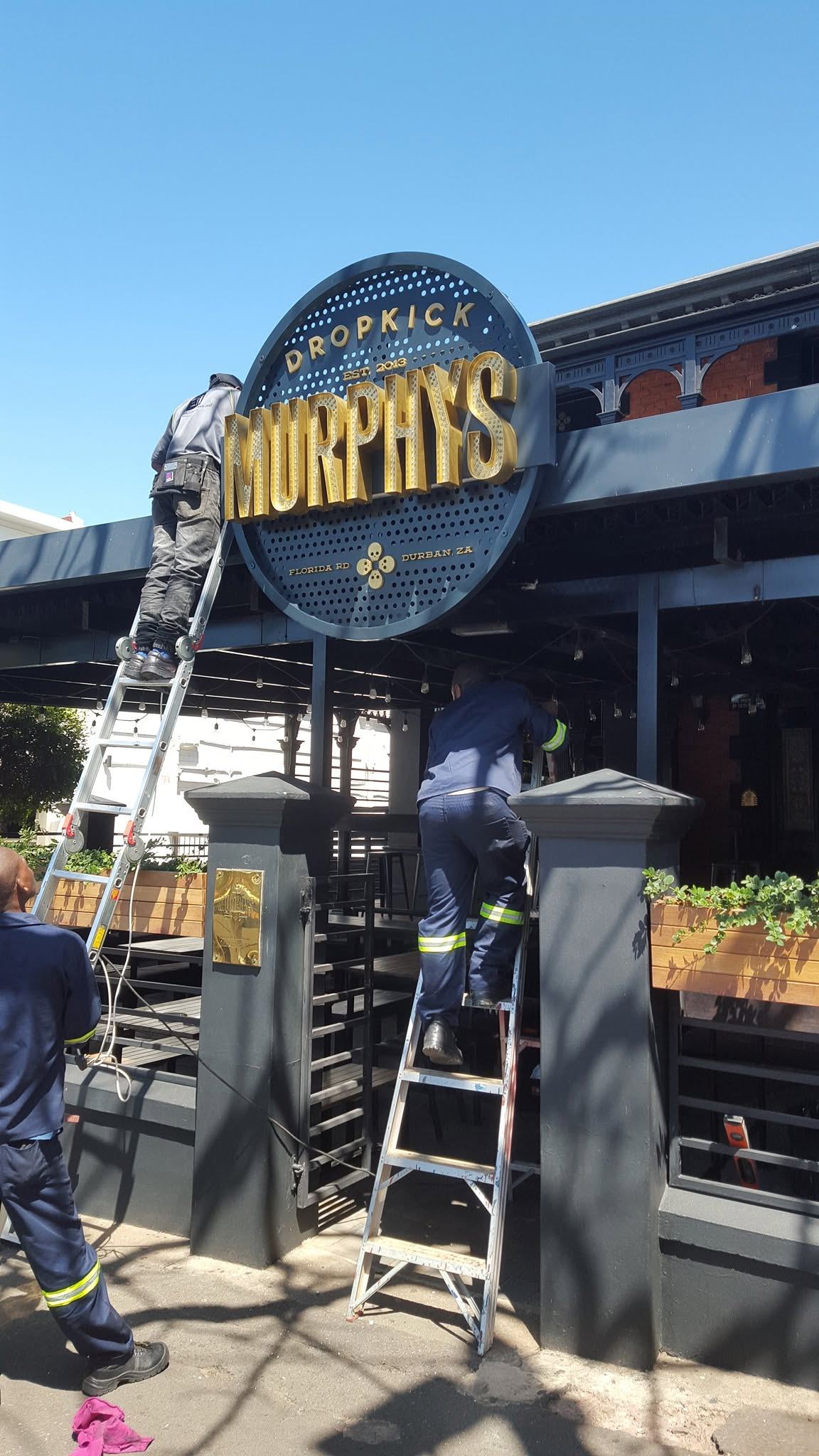 Custom signage frame for a client site
